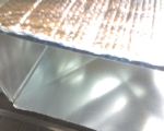Sheet metal ducting insulated on outside.